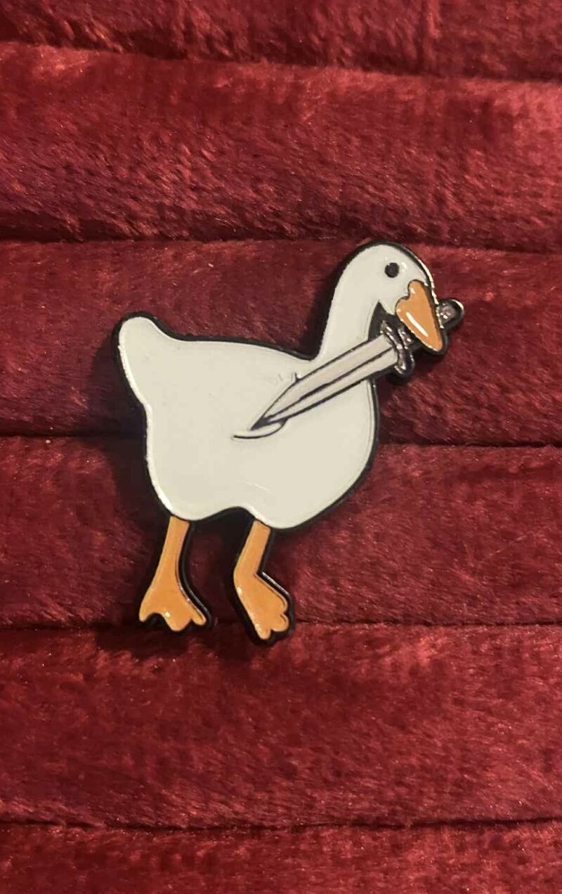 Duck with a dagger pin 