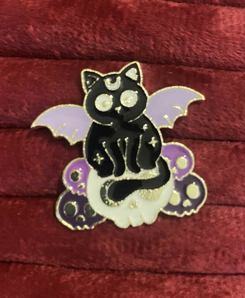Winged magic cat pin