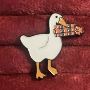 Duck with a bomb pin