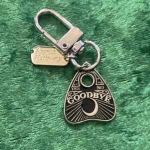 Goodbye Ouija Plec bag charm.